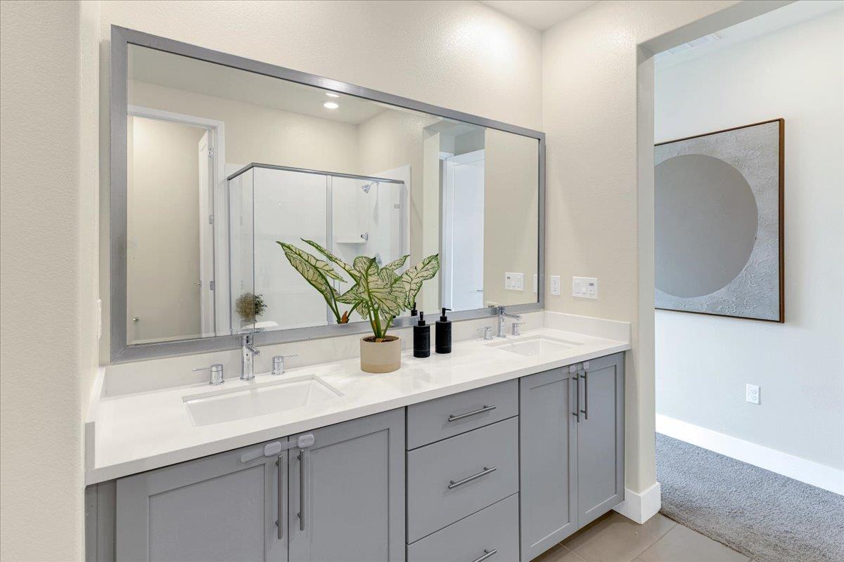 122 Ranch Lane Mountain View, CA 94040 - Photo 39 of 69 a bathroom with a double vanity sink and a mirror