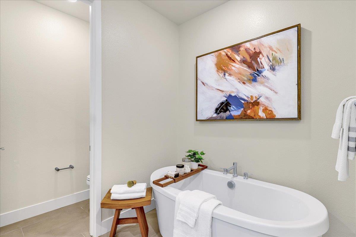 122 Ranch Lane Mountain View, CA 94040 - Photo 42 of 69 a bathroom with a sink and a painting on the wall