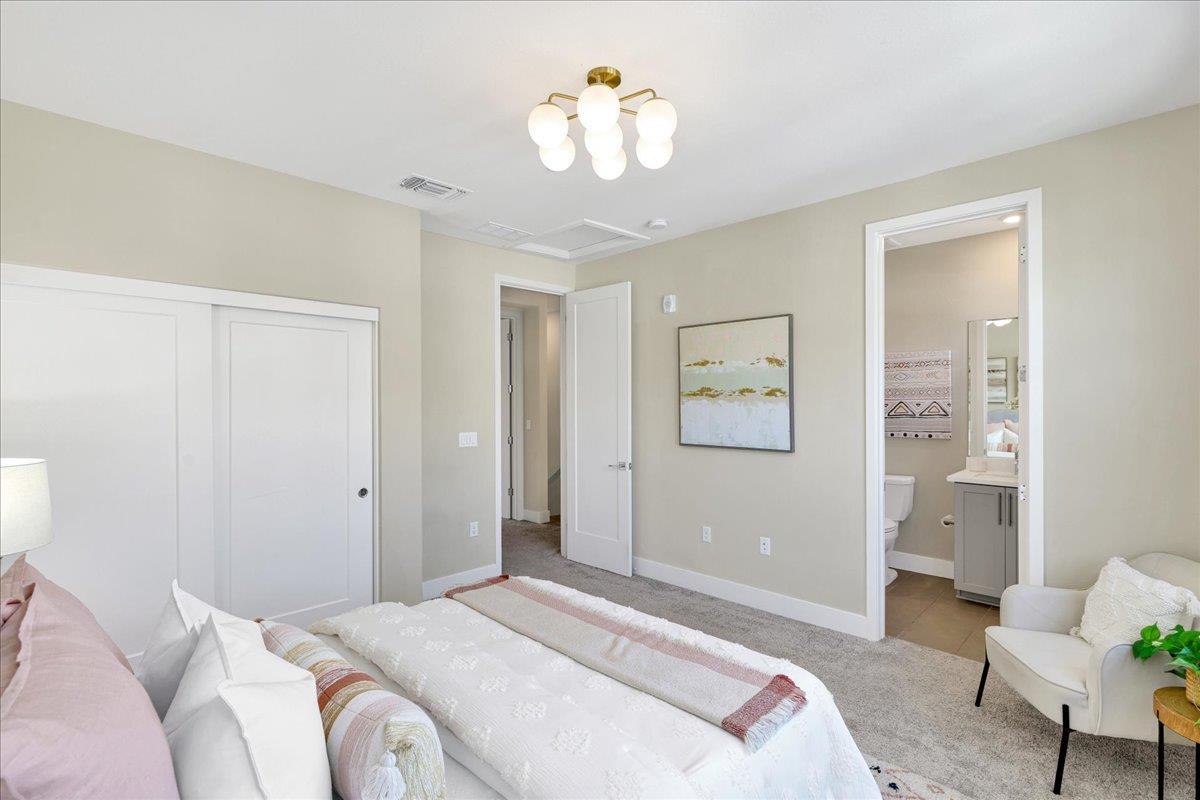 122 Ranch Lane Mountain View, CA 94040 - Photo 47 of 69 a bedroom with a bed and a chandelier