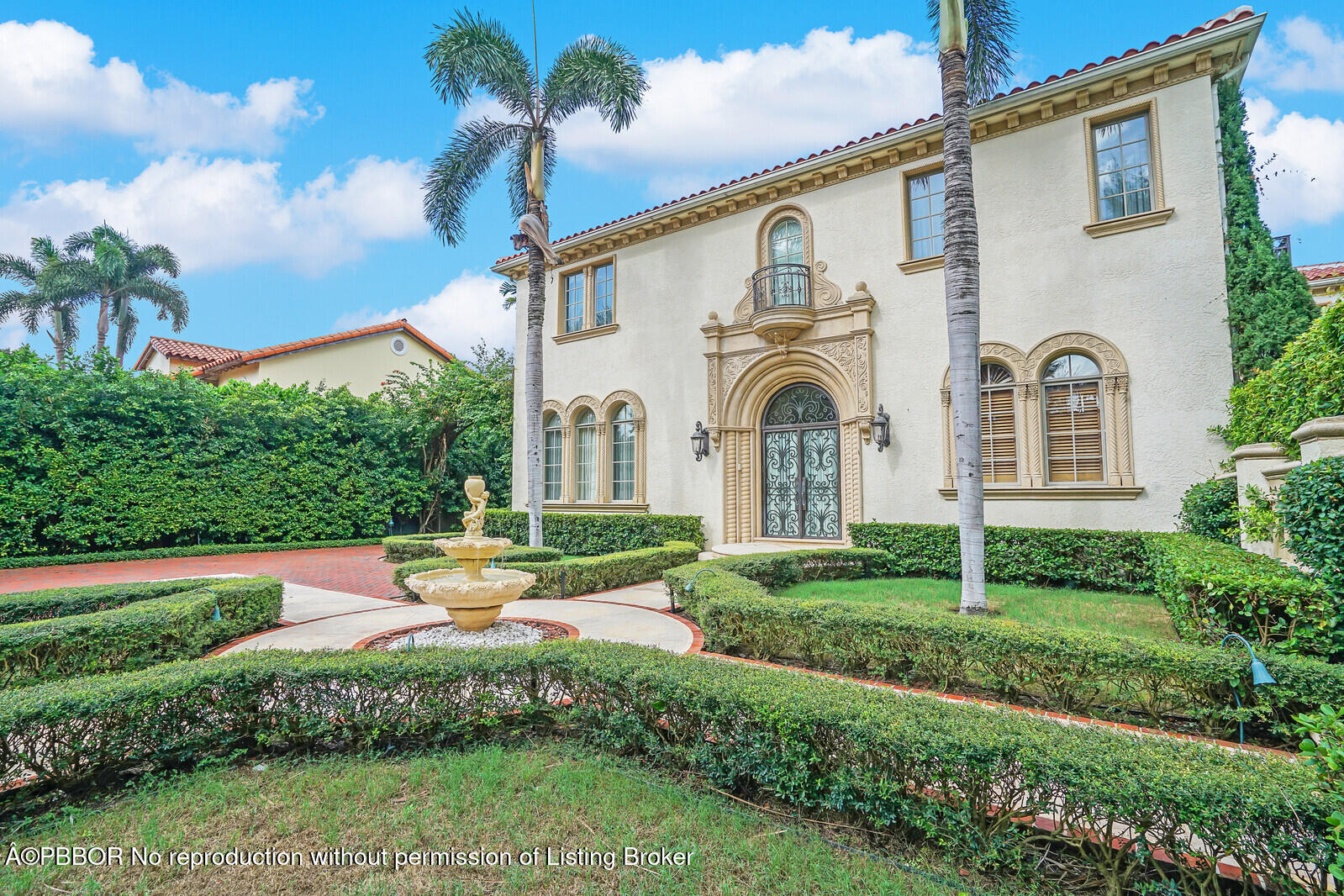 231 Wells Road Palm Beach, FL 33480 - Photo 2 of 39 a view of a white house with a yard and plants