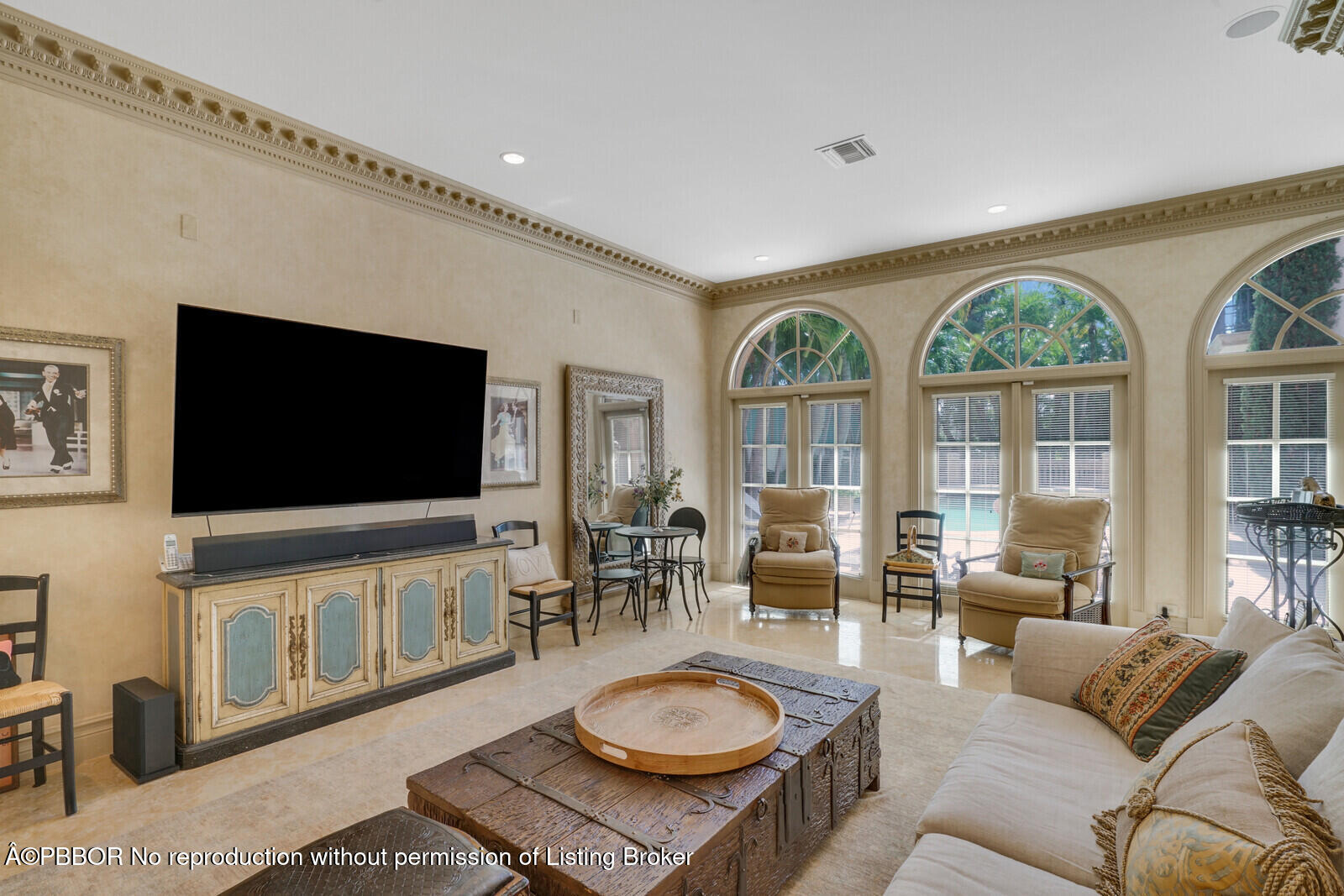 231 Wells Road Palm Beach, FL 33480 - Photo 22 of 39 a living room with furniture a flat screen tv and a floor to ceiling window