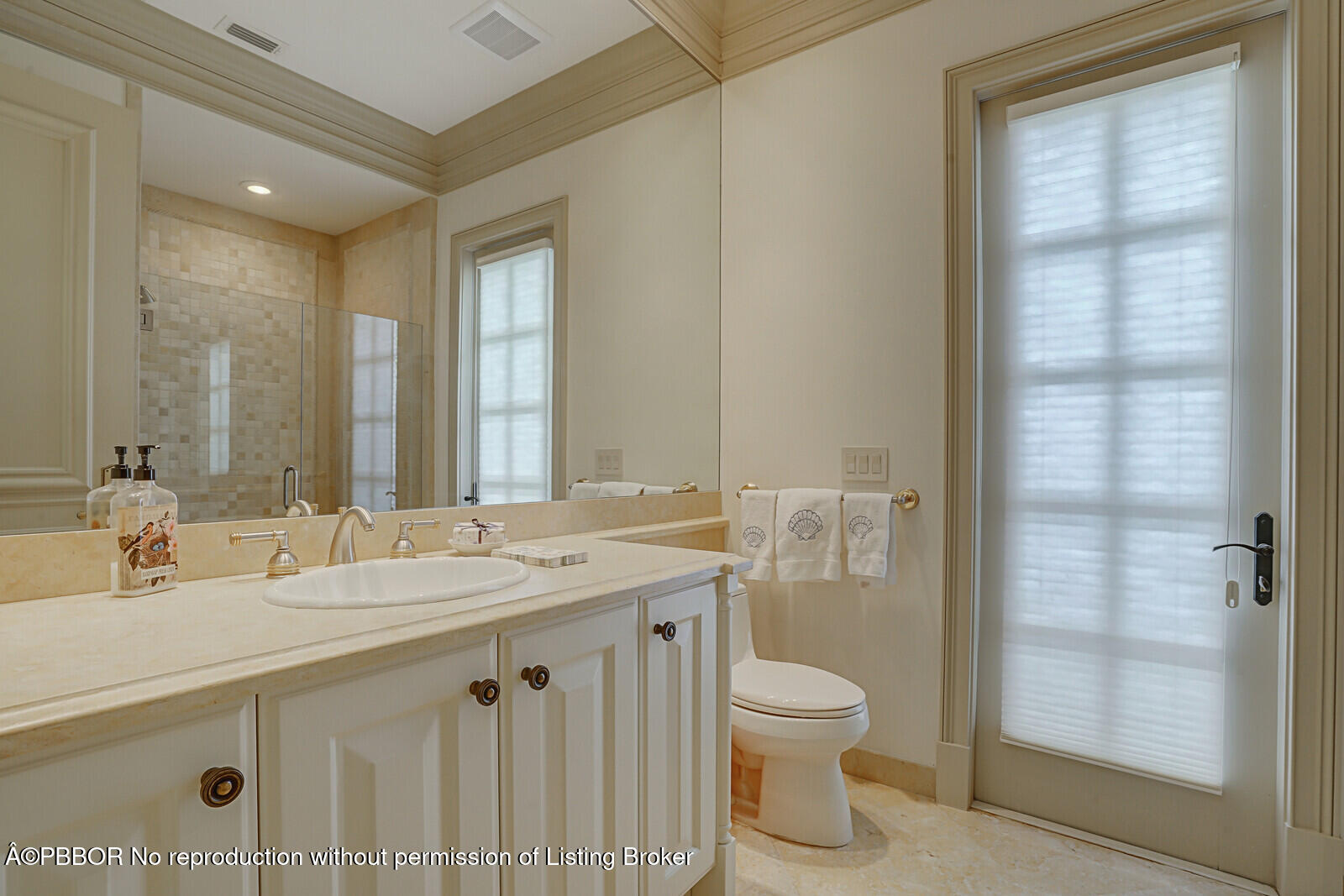 231 Wells Road Palm Beach, FL 33480 - Photo 24 of 39 a bathroom with a granite countertop sink toilet and shower