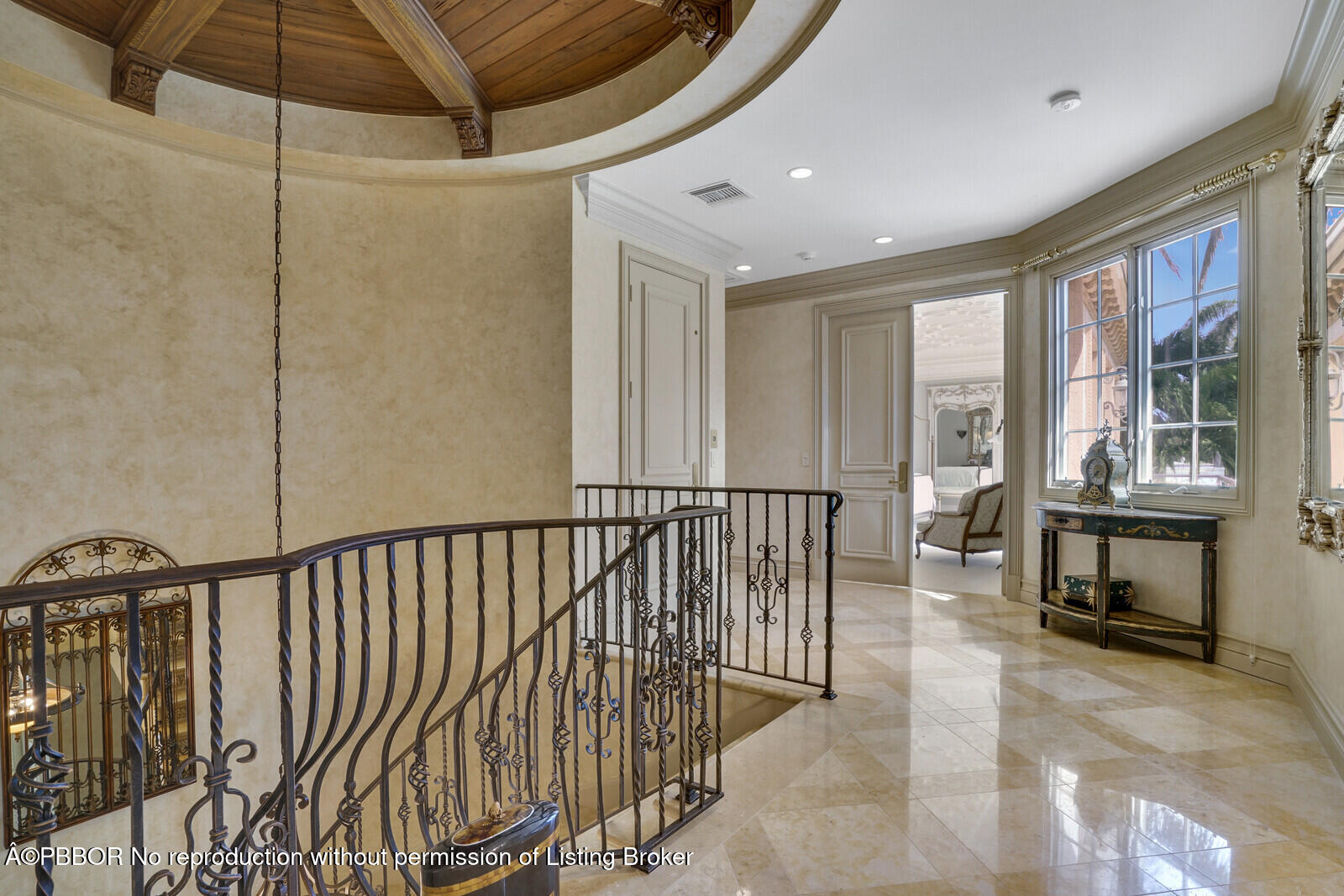 231 Wells Road Palm Beach, FL 33480 - Photo 25 of 39 a view of a hallway with wooden floor and furniture