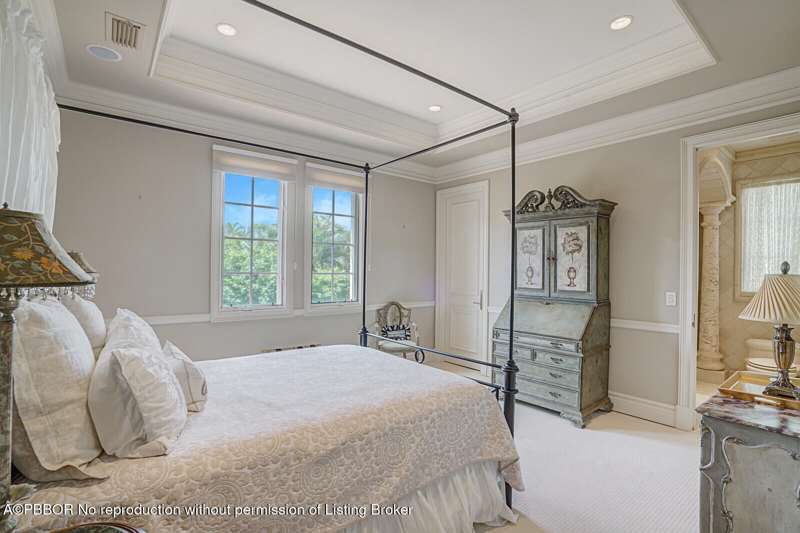 231 Wells Road Palm Beach, FL 33480 - Photo 31 of 39 a bedroom with a large bed and a chandelier
