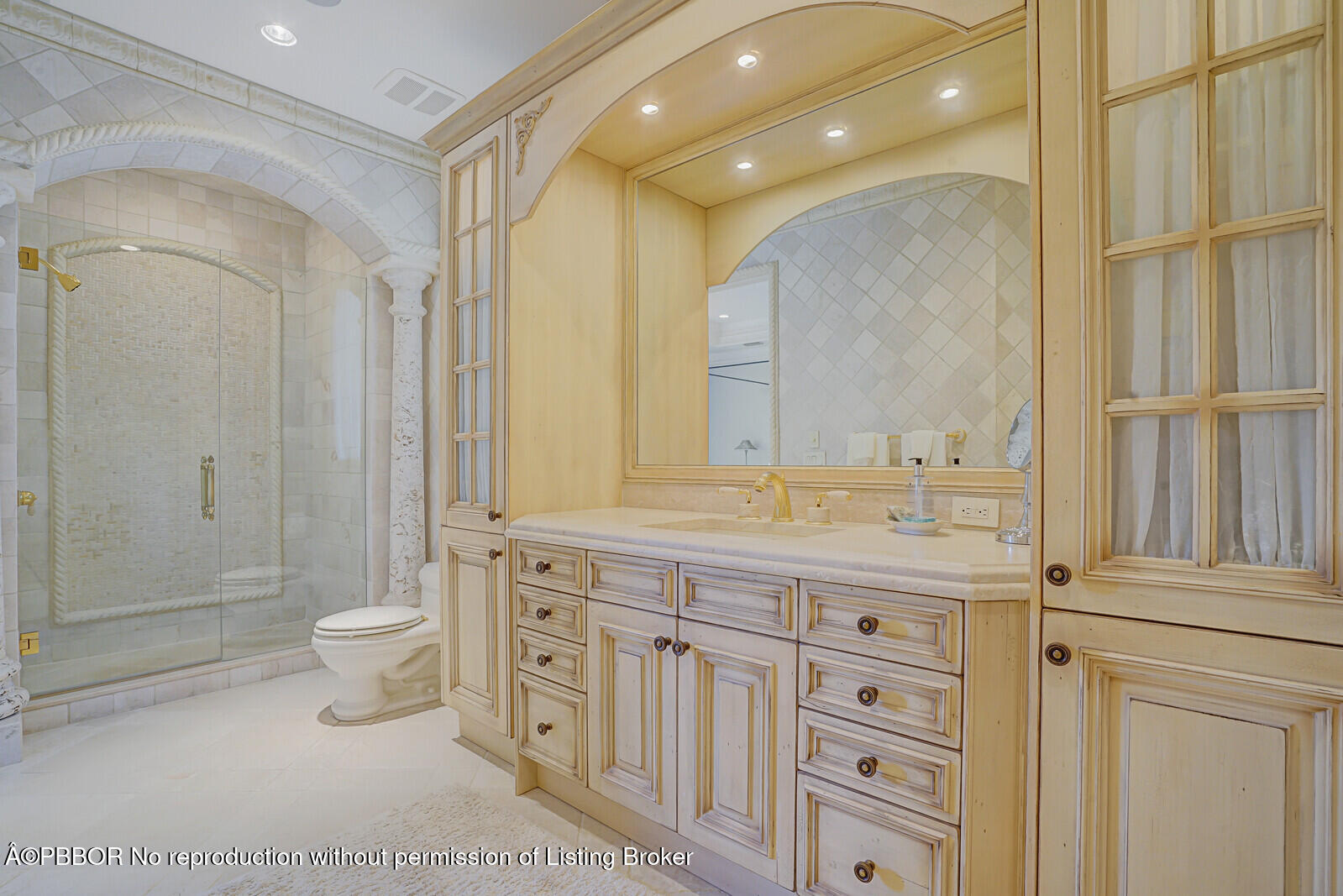 231 Wells Road Palm Beach, FL 33480 - Photo 32 of 39 a bathroom with a double vanity sink a toilet and a shower