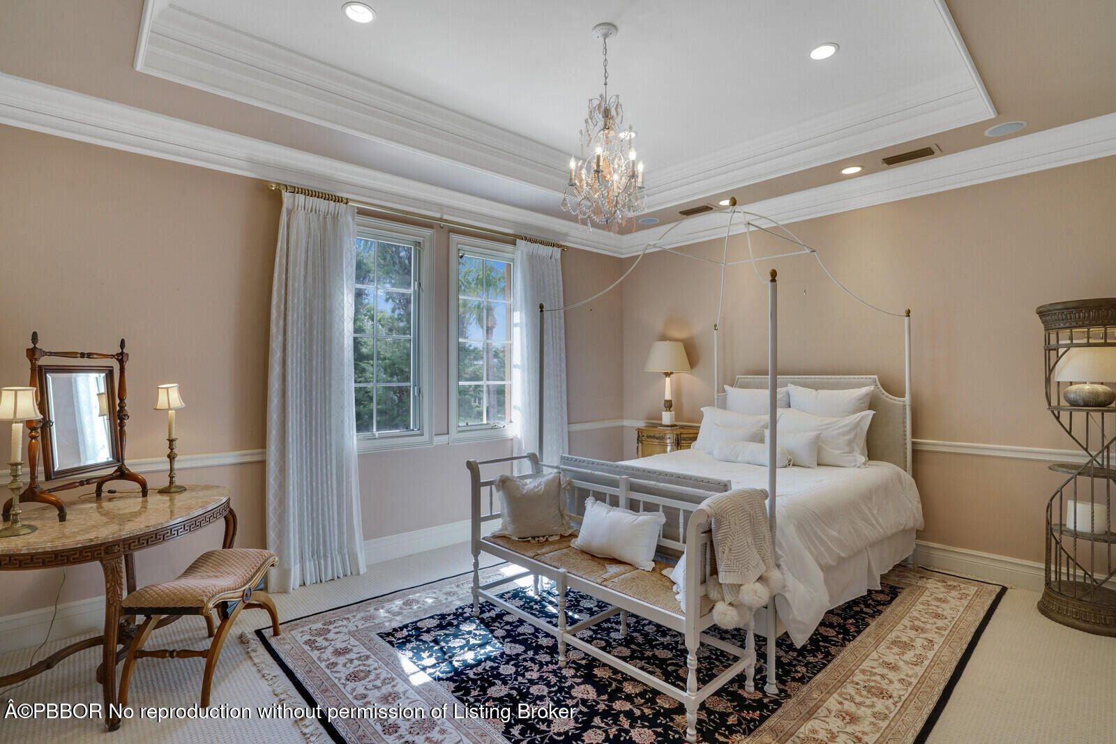 231 Wells Road Palm Beach, FL 33480 - Photo 35 of 39 a bedroom with a large bed a chandelier and windows