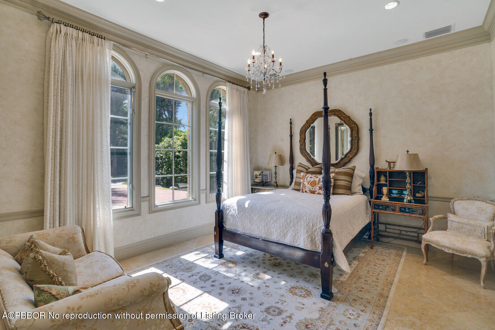 231 Wells Road Palm Beach, FL 33480 - Photo 5 of 39 a bedroom with a bed a chandelier and dresser