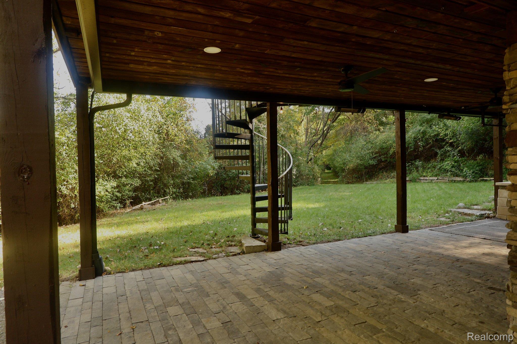 8312 Whitmore Lake Road Brighton, MI 48116 - Photo 20 of 43 Covered outdoor patio with paver flooring, wood-finish ceiling, and recessed lighting