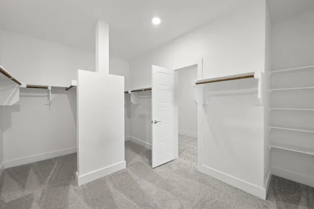 a view of an empty room with a garage