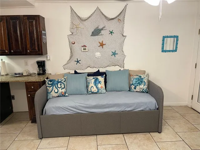 a bedroom with a bed and dresser