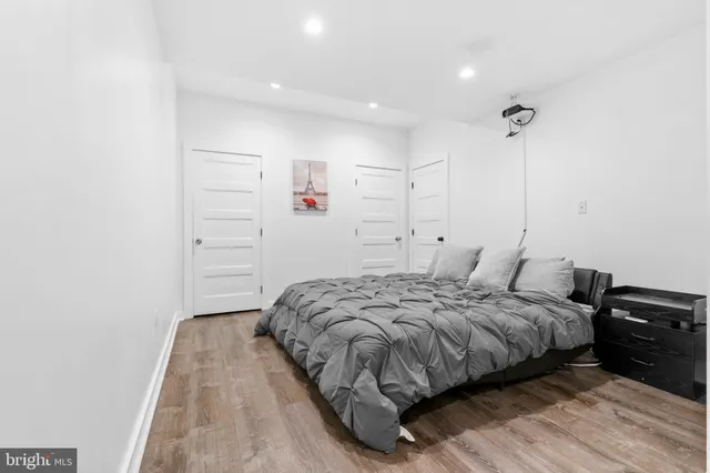 a bedroom with a bed and a ceiling fan