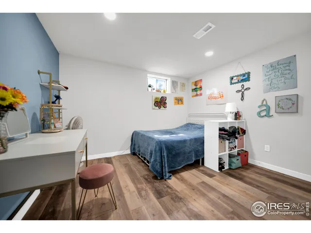 a bedroom with a bed and a table in it