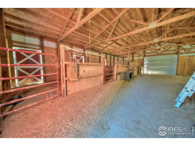 a view of an empty room with a staircase