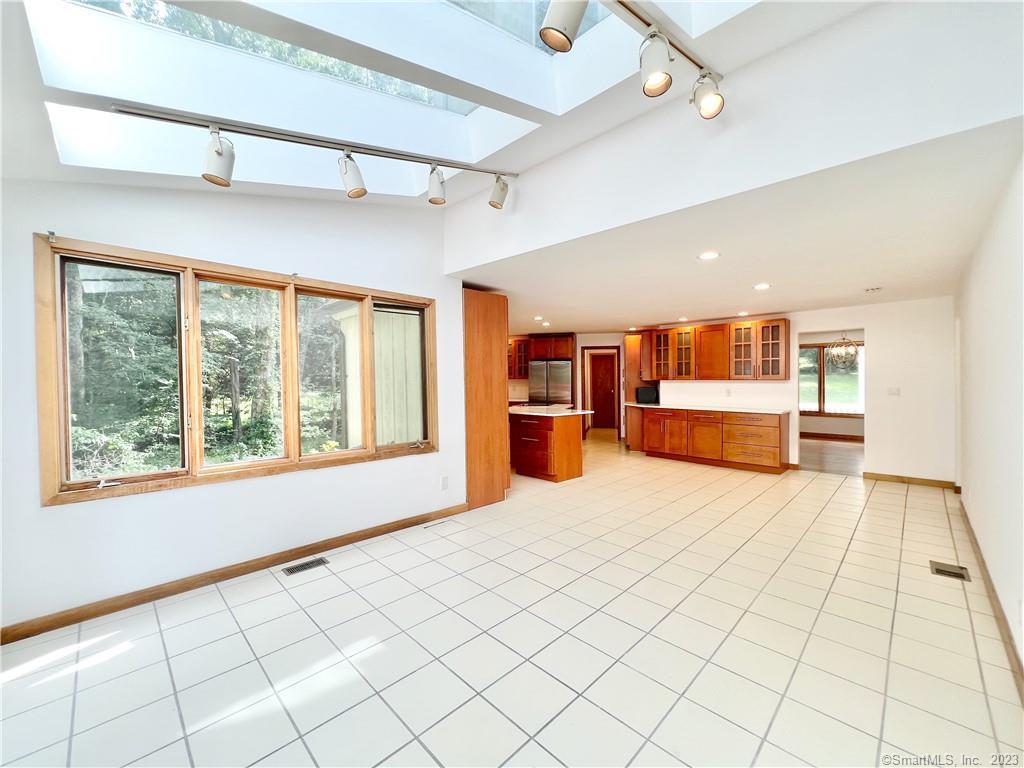 314 Erskine Road Stamford, CT 06903 - Photo 12 of 29 Glass lined dining area