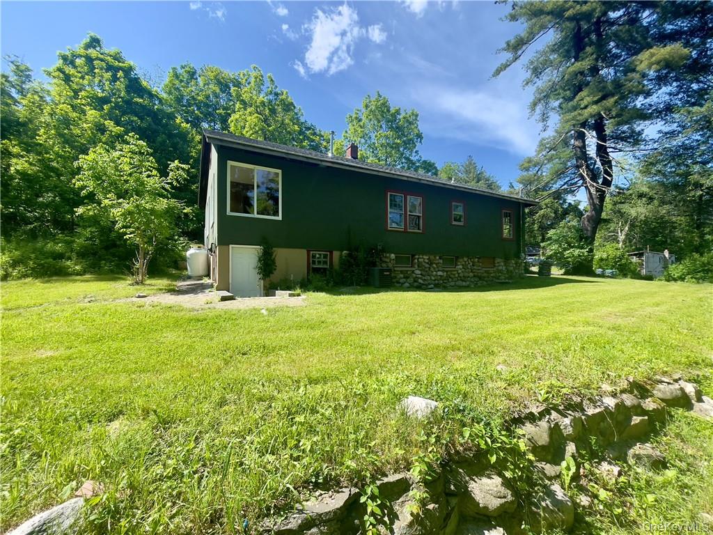 4 Old Turnpike Road Bloomingburg, NY 12721 - Photo 5 of 27 Back of property with central AC and a lawn