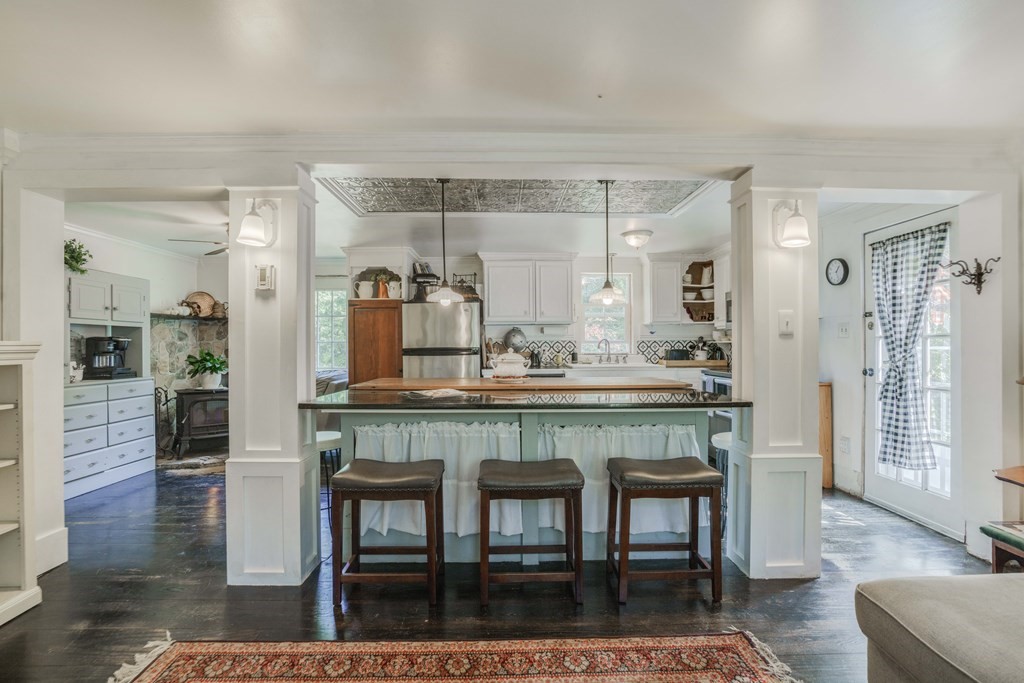 229 Osborne Road Ware, MA 01082 - Photo 12 of 28 a kitchen with stainless steel appliances kitchen island granite countertop dining table chairs and granite counter tops