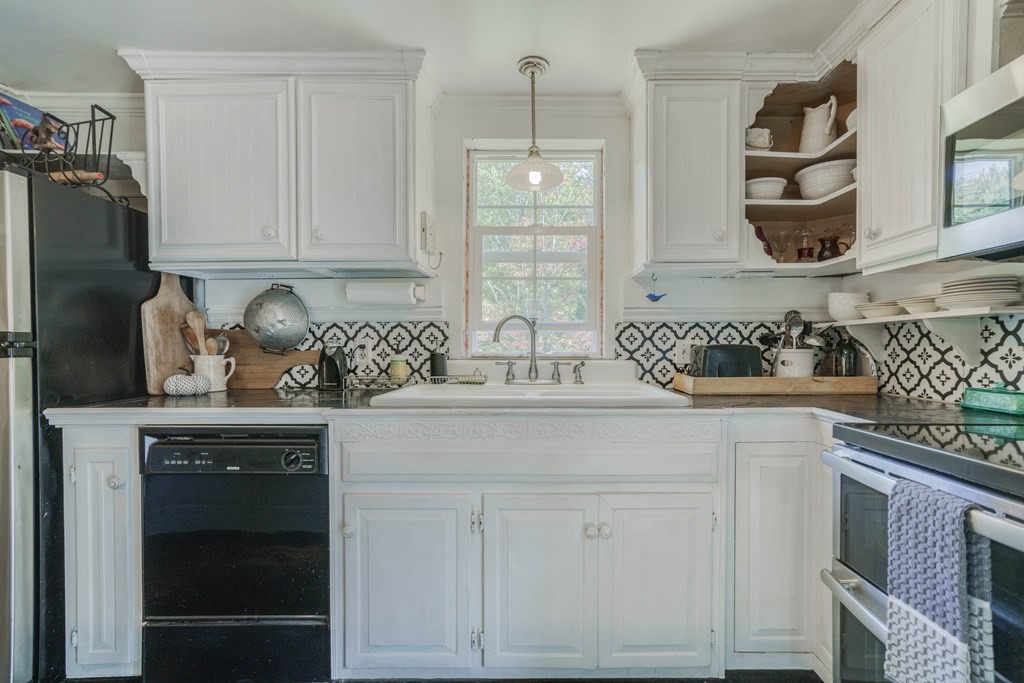 229 Osborne Road Ware, MA 01082 - Photo 18 of 28 a kitchen with white cabinets and a sink