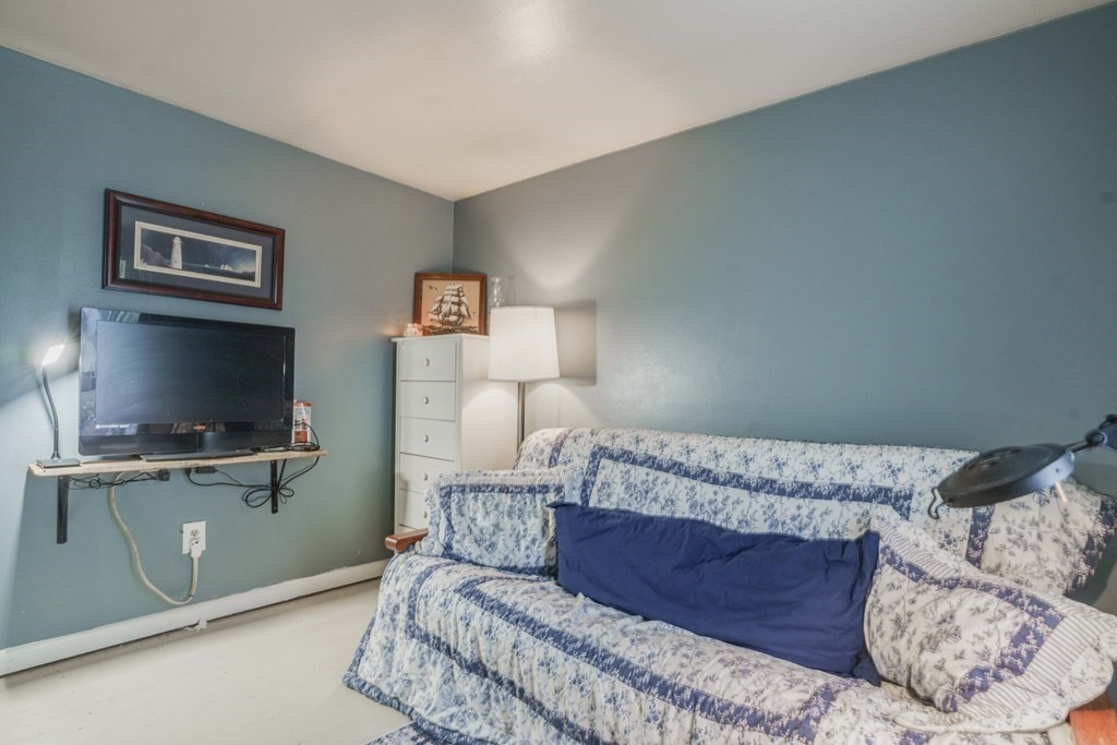 229 Osborne Road Ware, MA 01082 - Photo 26 of 28 a bedroom with a bed and flat screen tv