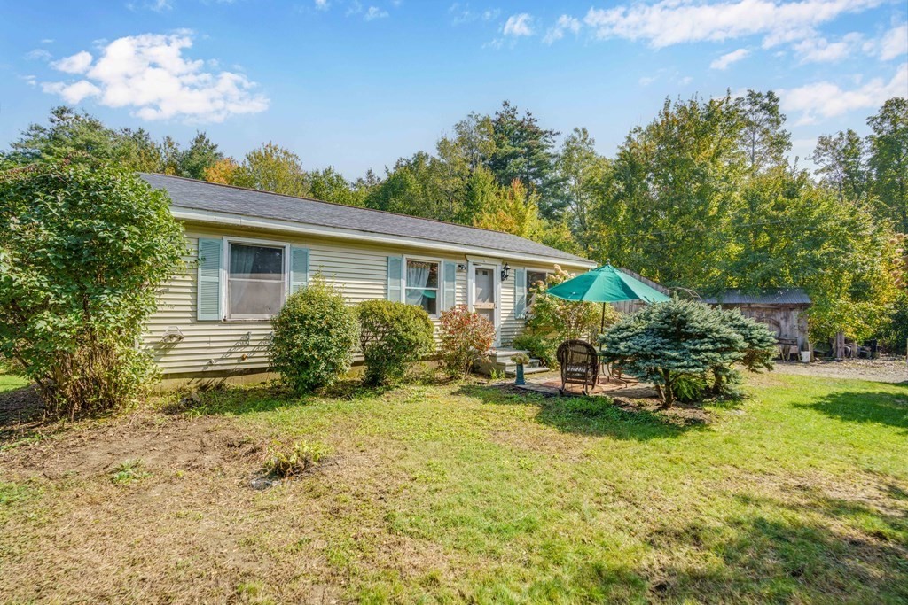 229 Osborne Road Ware, MA 01082 - Photo 3 of 28 a view of a house with backyard porch and sitting area
