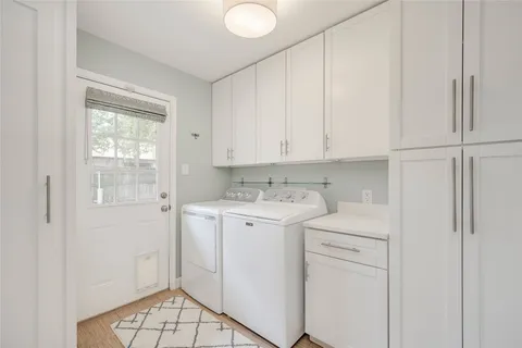 a view of a storage and utility room with a window