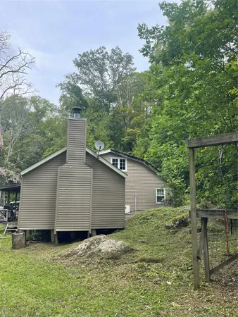 a backyard of a house with lots of green space
