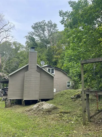 a backyard of a house with lots of green space