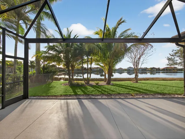 a view of a livingroom with a ceiling fan and window
