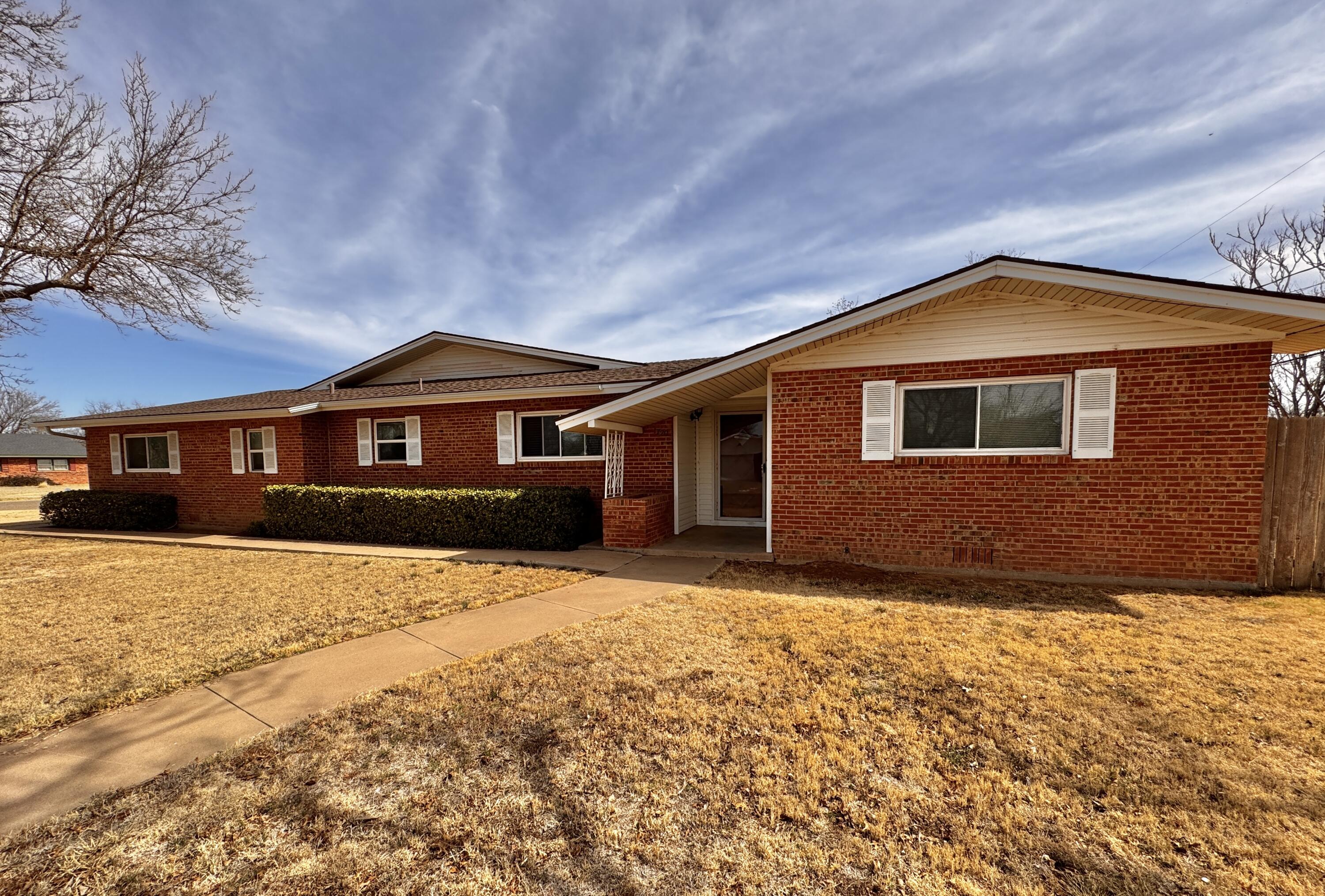 1720 Canyon Plainview, TX 79072 - Photo 2 of 49 a front view of house with yard