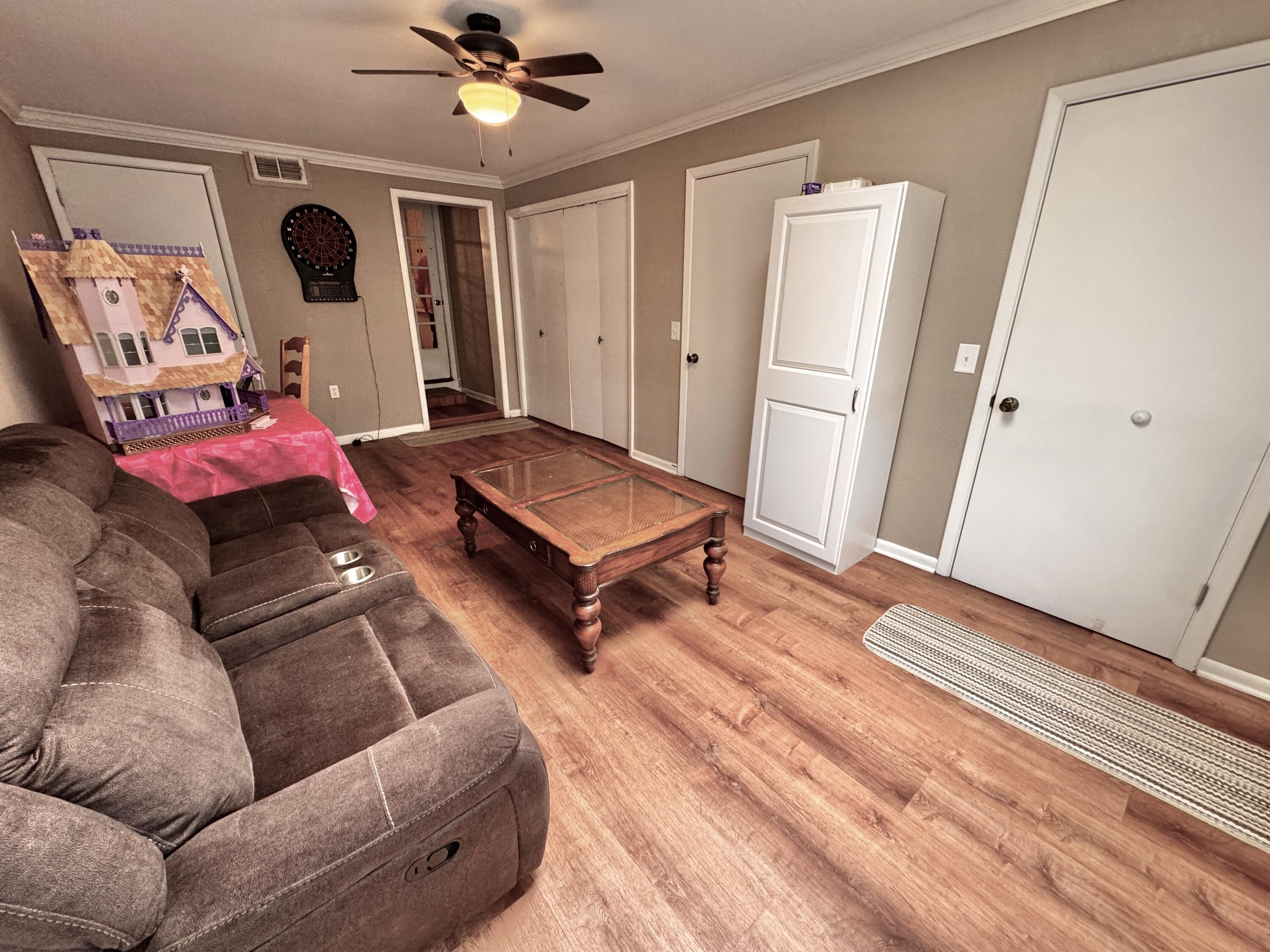 1720 Canyon Plainview, TX 79072 - Photo 25 of 49 a living room with furniture and a wooden floor