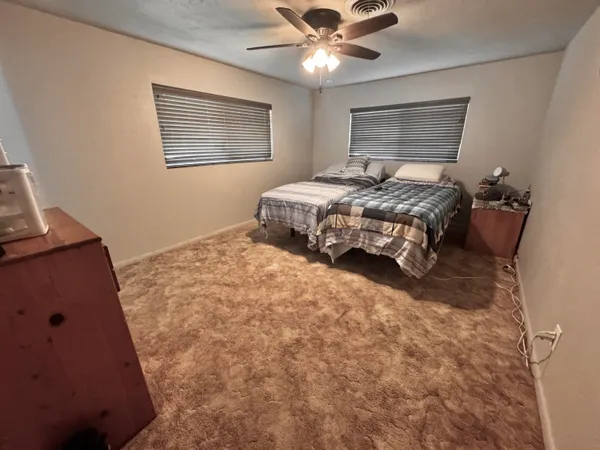 a bedroom with a bed and window