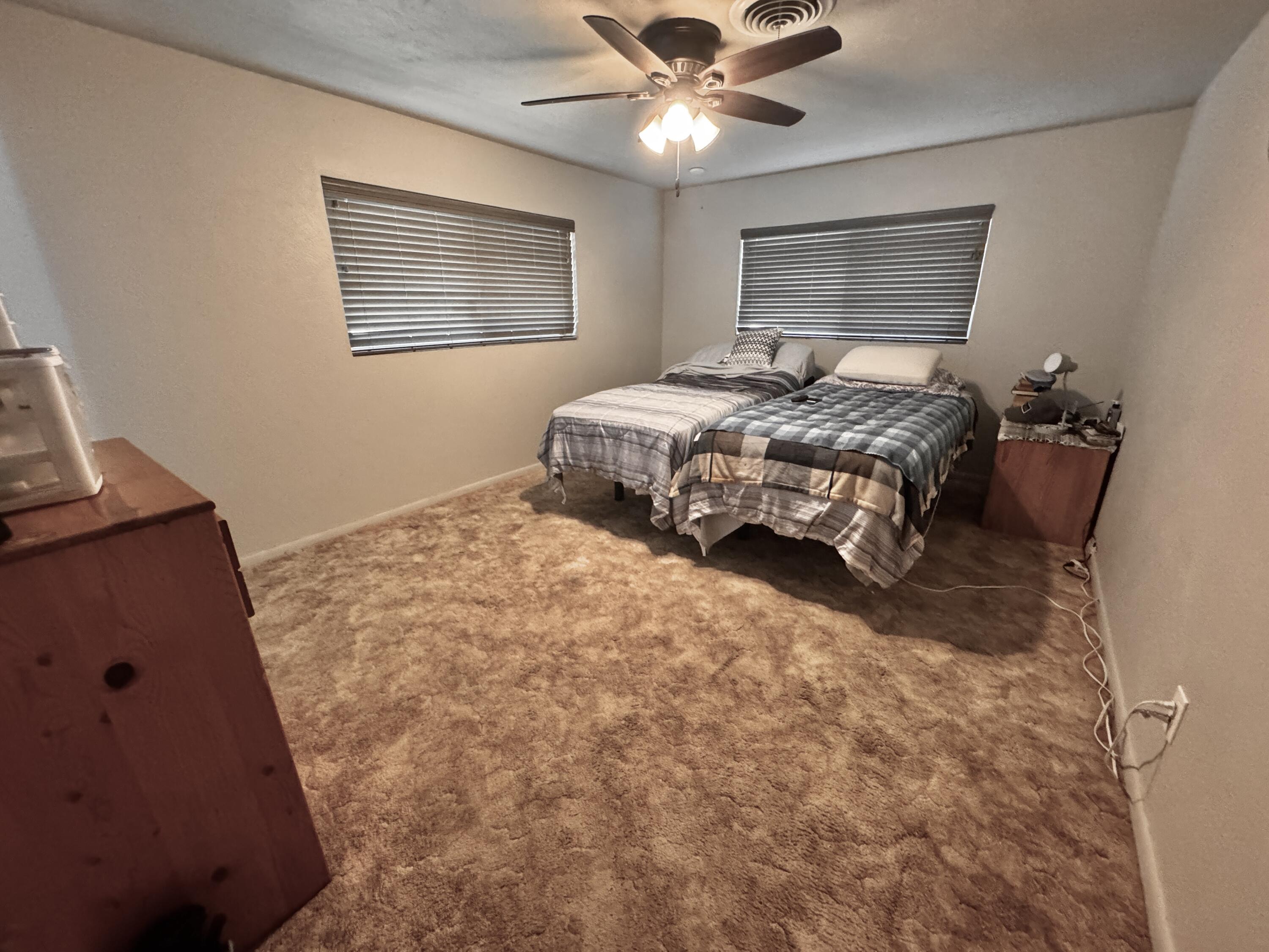 1720 Canyon Plainview, TX 79072 - Photo 29 of 49 a bedroom with a bed and window