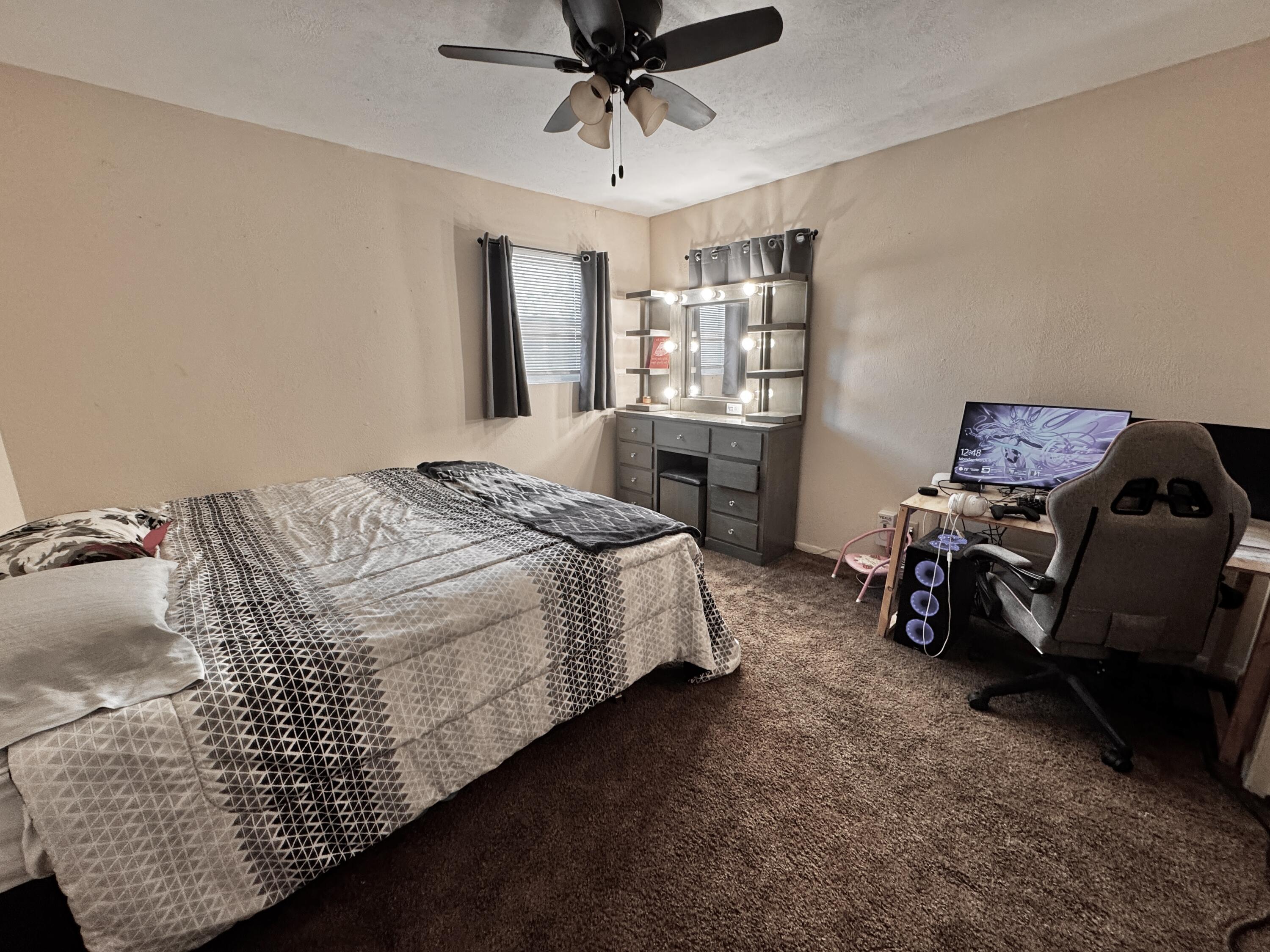 1720 Canyon Plainview, TX 79072 - Photo 38 of 49 a bedroom with bed and window