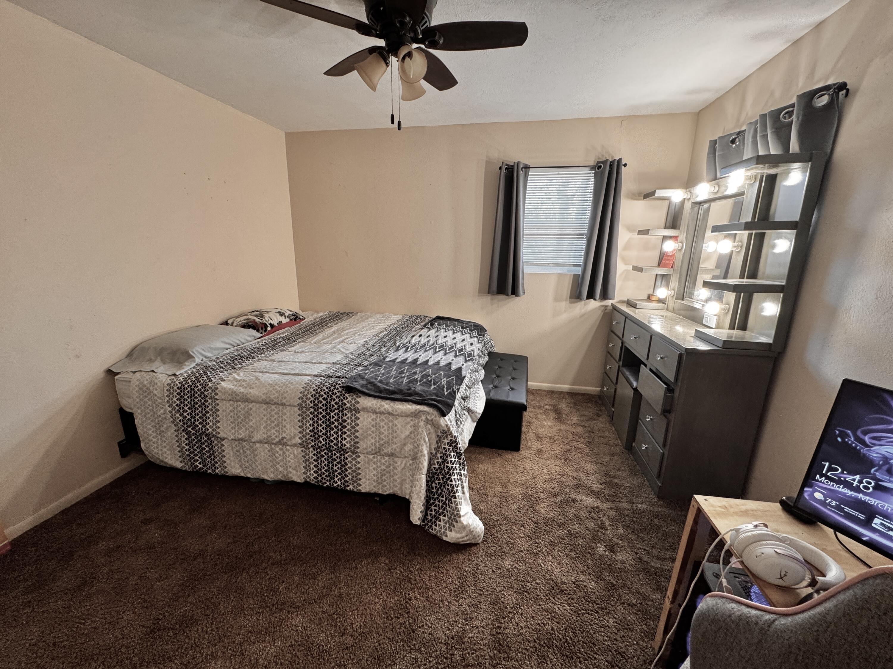 1720 Canyon Plainview, TX 79072 - Photo 39 of 49 a bedroom with a bed wooden floor and window