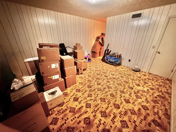 a bed room with a bed and a couch