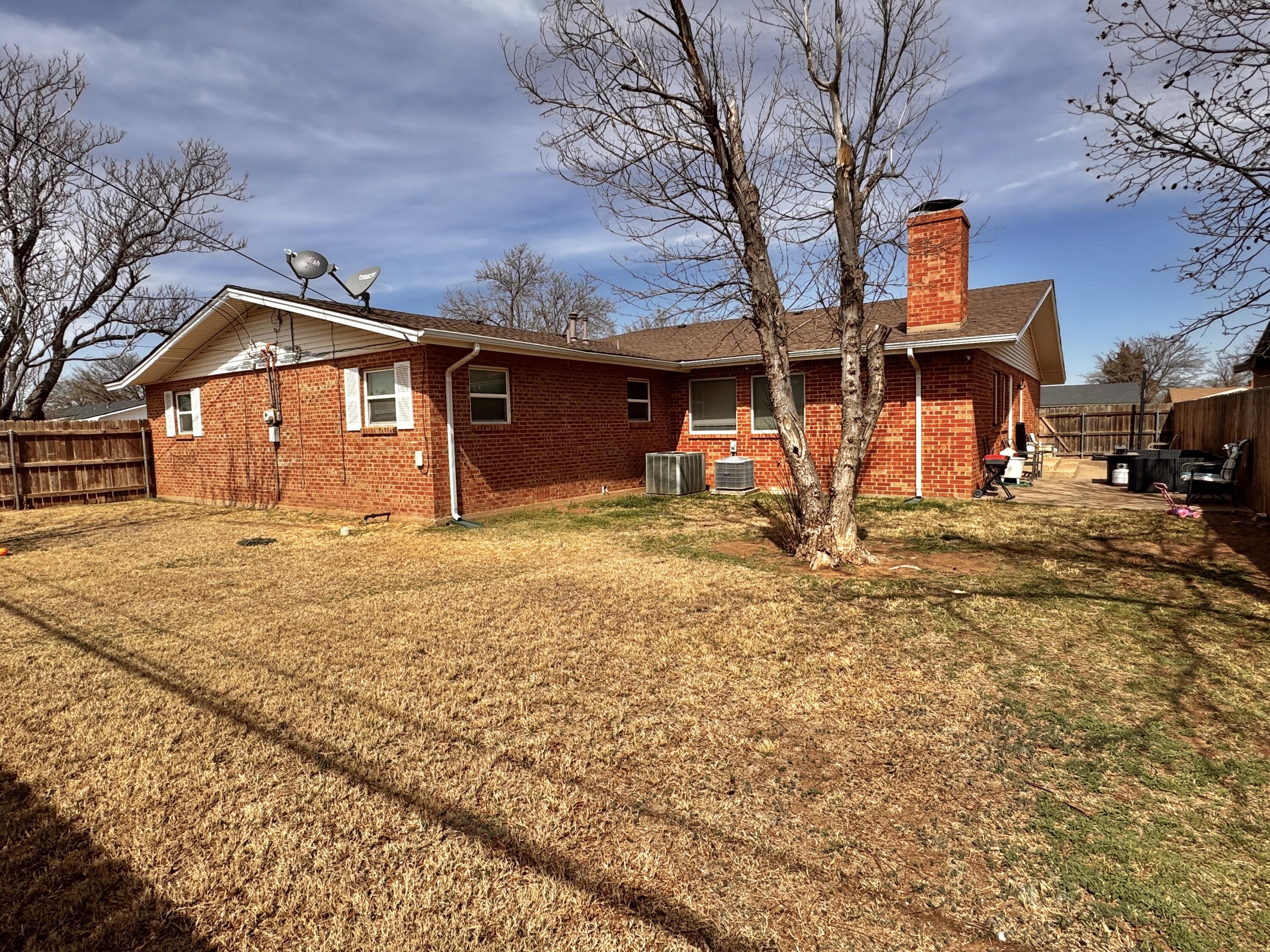 1720 Canyon Plainview, TX 79072 - Photo 47 of 49 a front view of a house with parking space