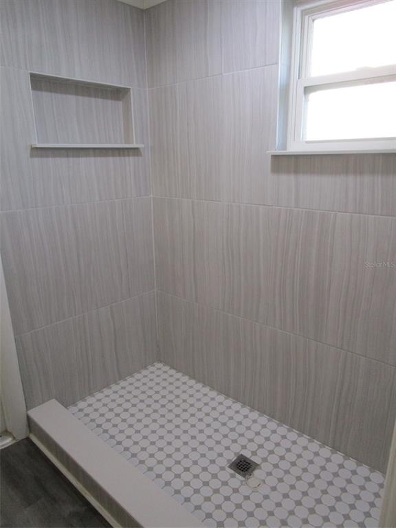 7226 San Moritz Drive Port Richey, FL 34668 - Photo 13 of 38 a bedroom with a bed and a window