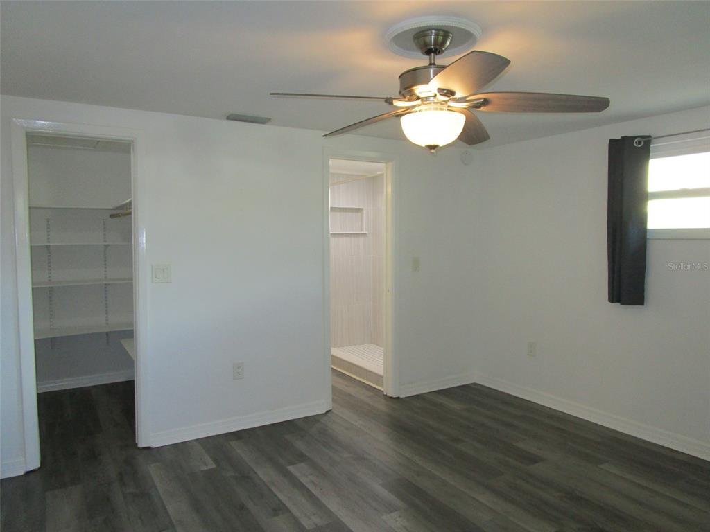 7226 San Moritz Drive Port Richey, FL 34668 - Photo 15 of 38 a view of a livingroom with a fan