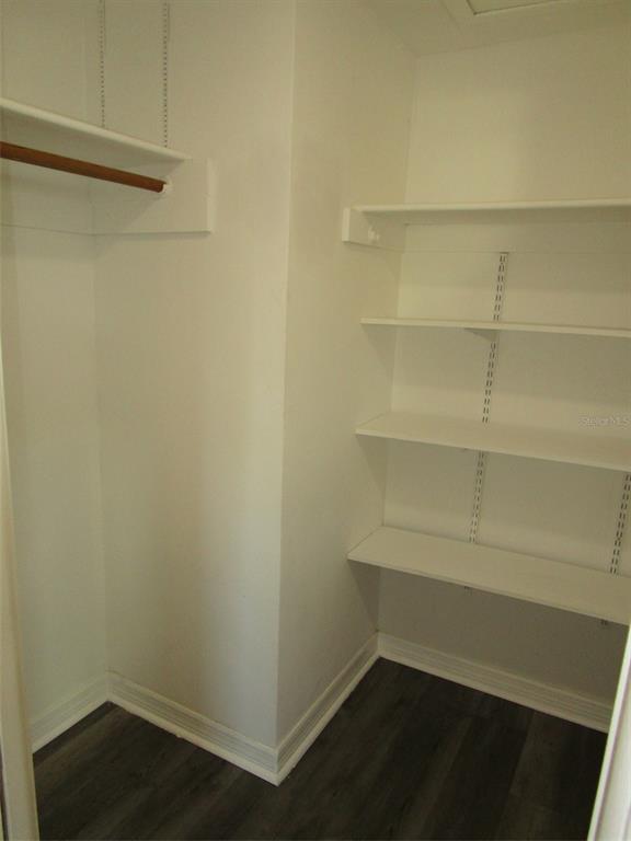 7226 San Moritz Drive Port Richey, FL 34668 - Photo 16 of 38 a empty closet with wooden floor