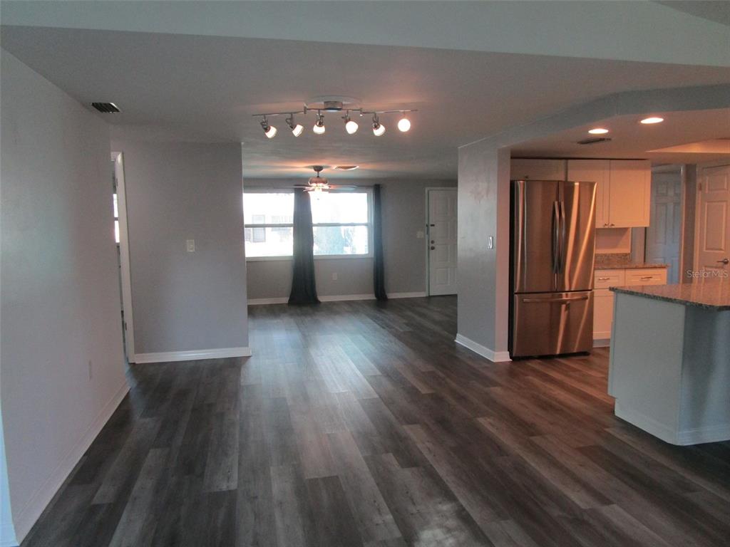 7226 San Moritz Drive Port Richey, FL 34668 - Photo 19 of 38 wooden floor in an empty room with a window