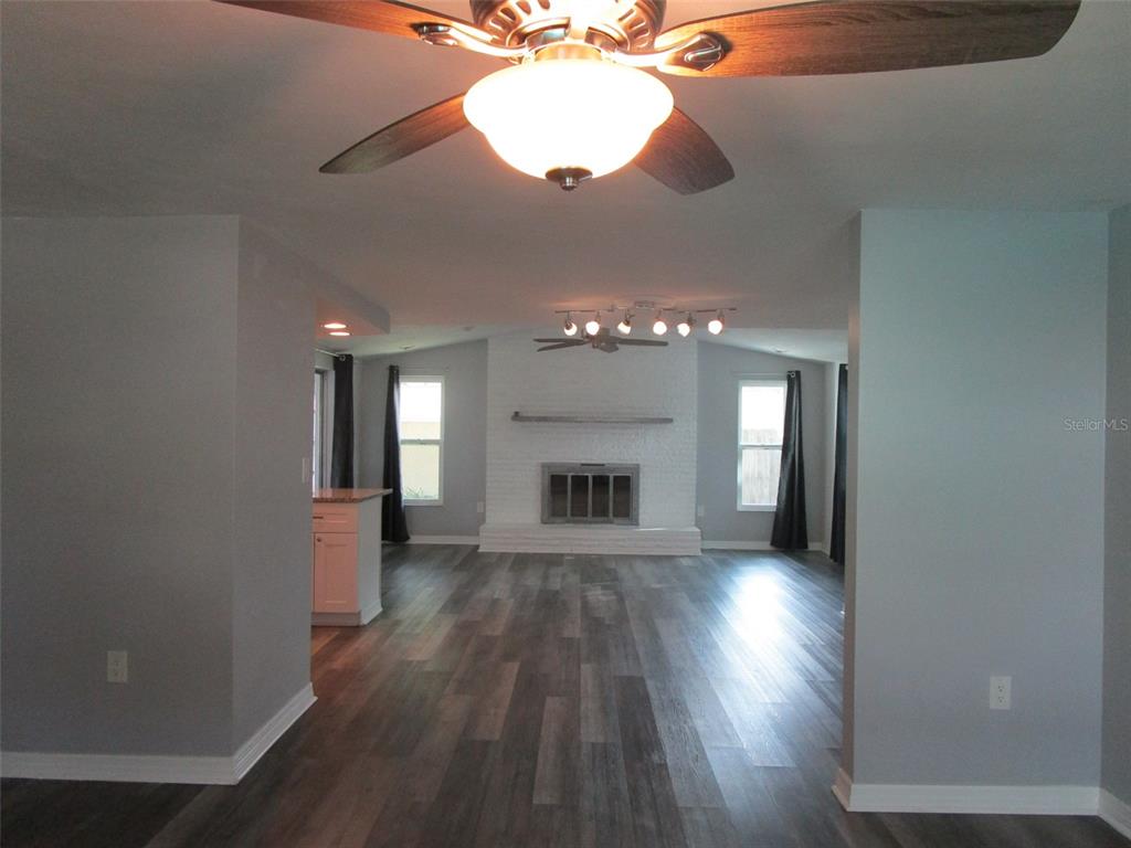 7226 San Moritz Drive Port Richey, FL 34668 - Photo 22 of 38 wooden floor in an empty room with a window