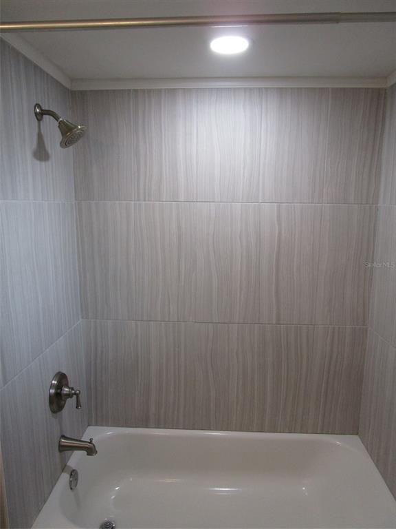 7226 San Moritz Drive Port Richey, FL 34668 - Photo 27 of 38 a bathroom with a shower