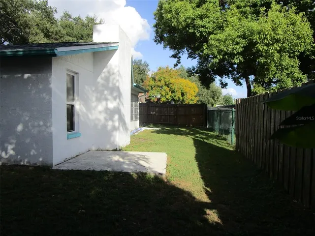 a view of a back yard of the house