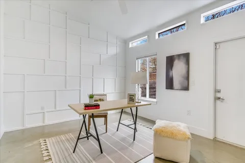 a workspace with furniture and wooden floor
