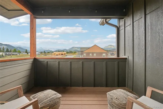 a bedroom with a bed and glass door