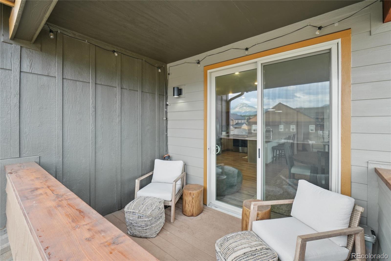 1700 Wildfire Road, Unit 301 Estes Park, CO 80517 - Photo 12 of 38 a bedroom with a bed and glass door