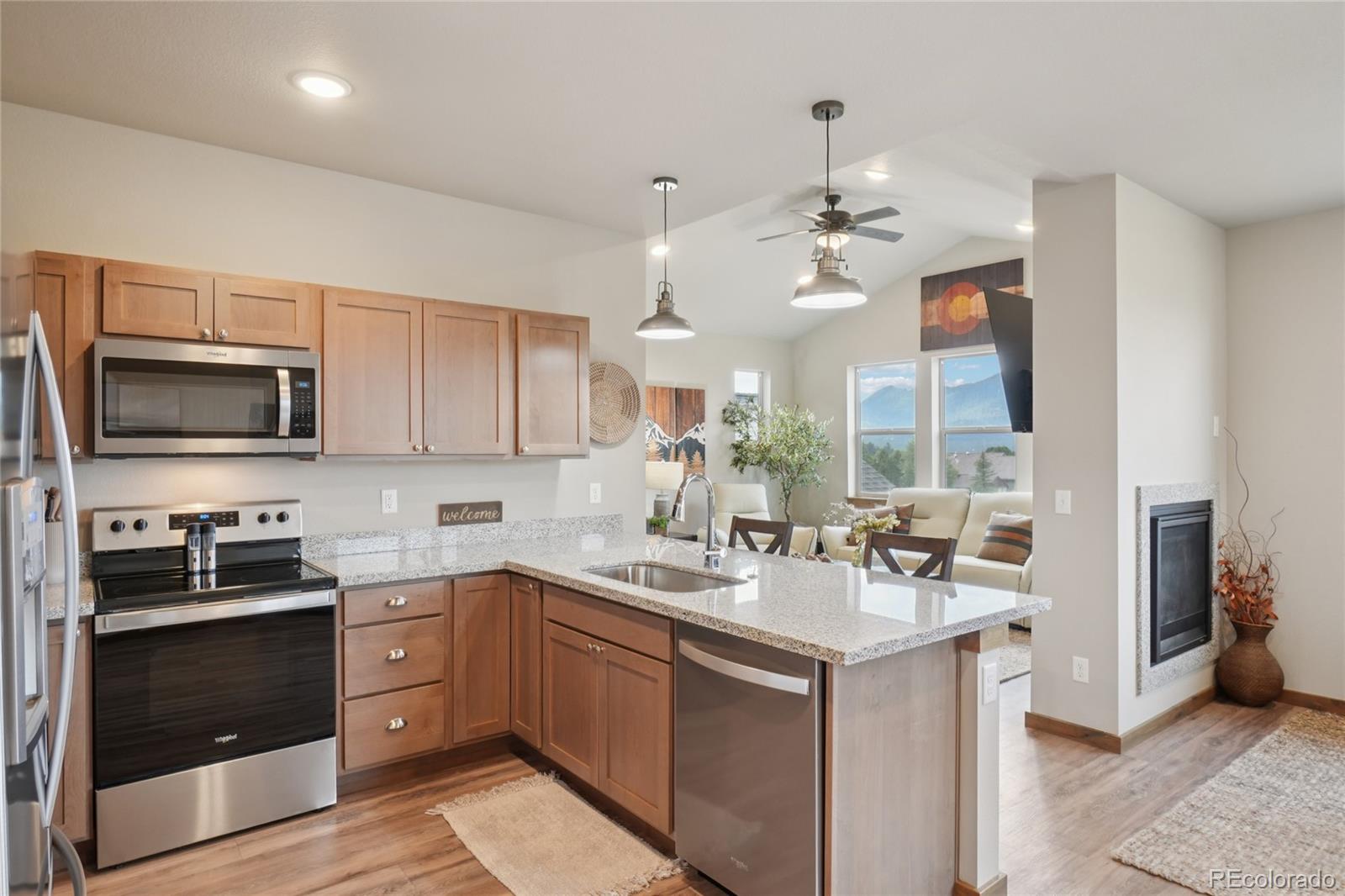 1700 Wildfire Road, Unit 301 Estes Park, CO 80517 - Photo 16 of 38 a kitchen with a sink appliances and cabinets