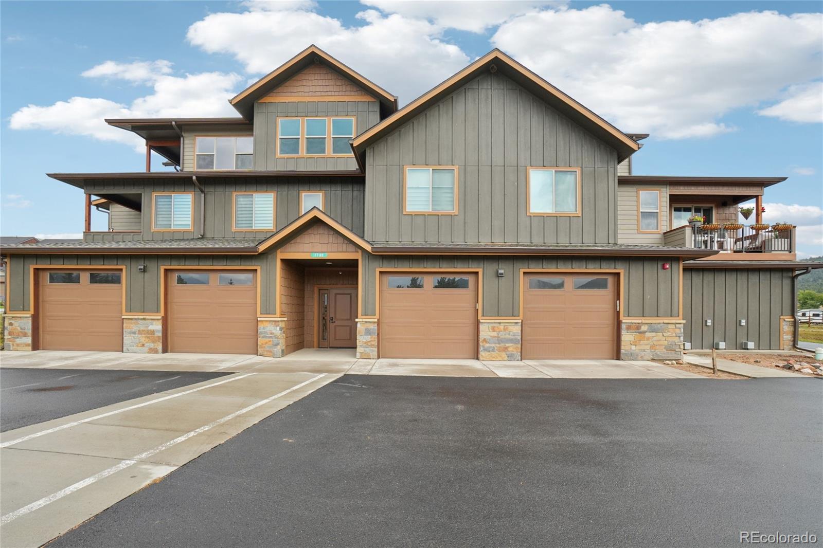 1700 Wildfire Road, Unit 301 Estes Park, CO 80517 - Photo 30 of 38 a front view of a house with yard