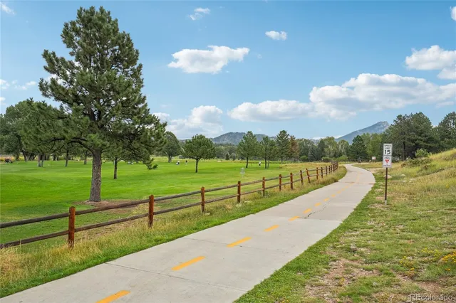 a view of a lake with sunset in the background