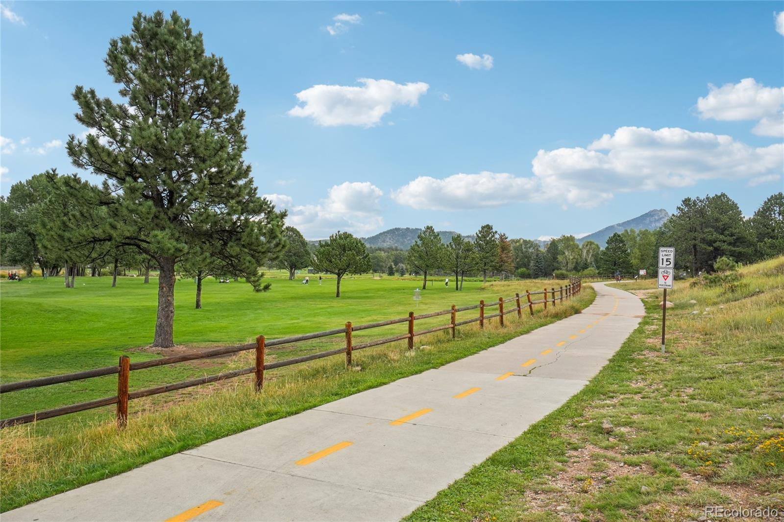 1700 Wildfire Road, Unit 301 Estes Park, CO 80517 - Photo 35 of 38 a view of a swimming pool with a yard