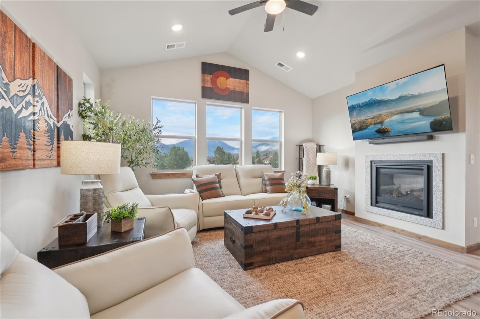 1700 Wildfire Road, Unit 301 Estes Park, CO 80517 - Photo 5 of 38 a living room with furniture fireplace and flat screen tv